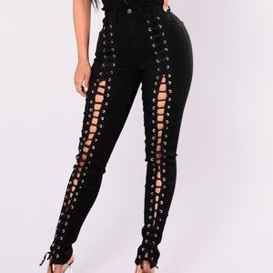 Lace up black high waisted denim jeans.
